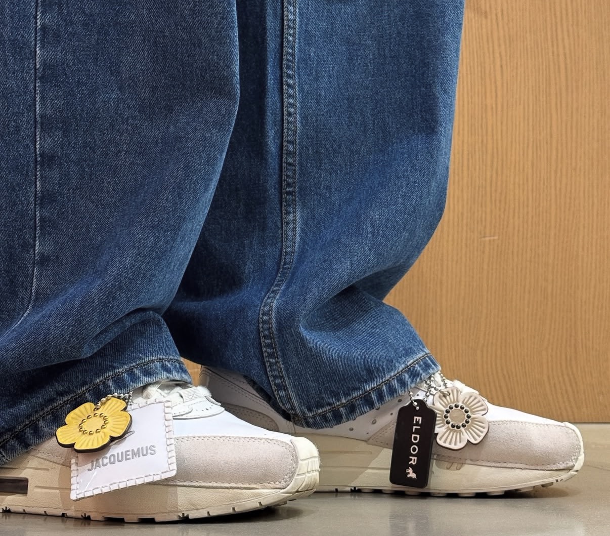 Eldor's own customized sneakers on his feet — flower charms and a black hangtag stamped ELDOR